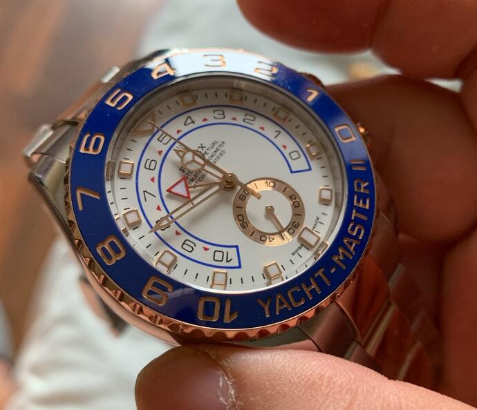 The blue and red elements are eye-catching on the white dial.